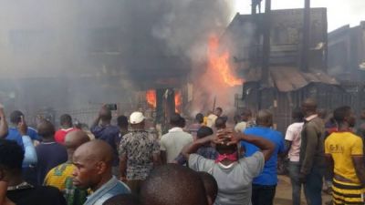 RIOTERS SET FIRE TO ABUJA MARKET; SHOPS, VEHICLES DESTROYED